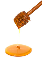 honey dripping from dipper