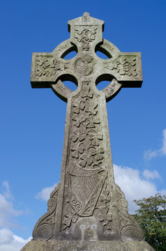 Irish celtic cross with shamrocks and harp