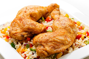 Roasted chicken legs, rice and vegetables