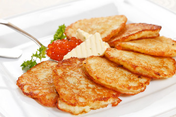 fried potatoes pancakes with caviar