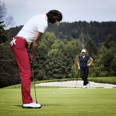 Two female golfer on green