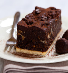 Chocolate cake and chocolate truffles with cocoa