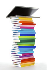 Laptop on book stack, side view