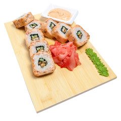 rolled sushi on wooden stand