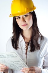 Beautiful business woman with construction plans