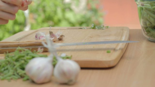 Shucking dry garlic cloves from skins on
