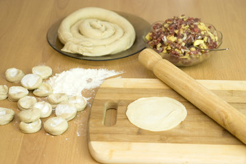 dough with minced meat patties cooking Asian samsa
