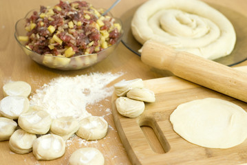 dough with minced meat patties cooking Asian samsa