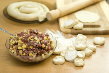 dough with minced meat patties cooking Asian samsa