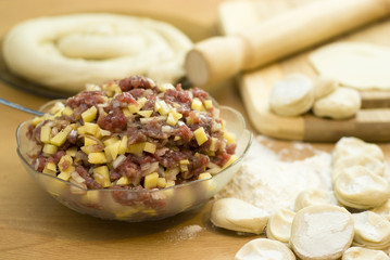 dough with minced meat patties cooking Asian samsa