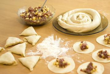 dough with minced meat patties cooking Asian samsa