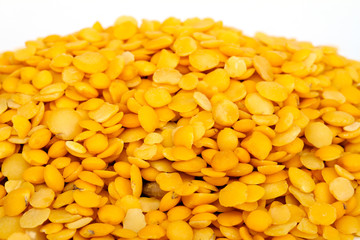Yellow lentils isolated on white background.Macro shot.
