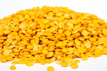 Yellow lentils isolated on white background.Macro shot.
