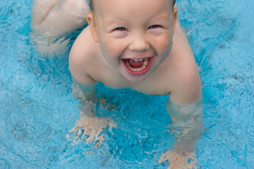 Little boy in a swimming pool