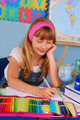 schoolgirl writing in notebook