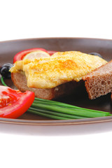 fish fillet with greek olives and tomatoes