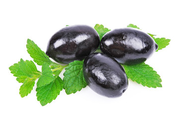 Black olives with green leaves isolated white background