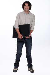 Computer technician holding monitor