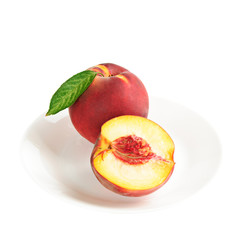 Fototapeta na wymiar Single fresh ripe peach on the dish