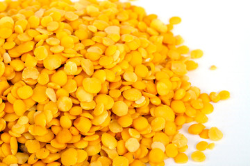 Yellow lentils isolated on white background.Macro shot.