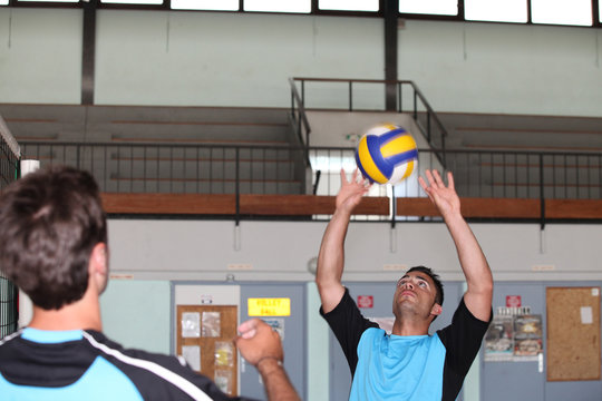 Handball team playing on indoor court
