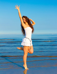 Naklejka premium Woman Dancing Beach