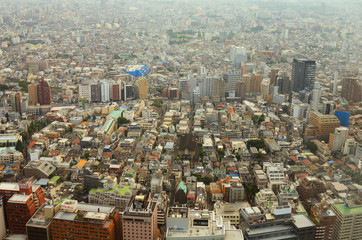 Smoggy Shinjuku cityscape in Tokyo, Japan