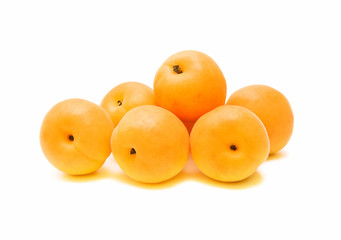 ripe apricots on a white background