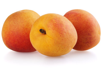 Three apricot fruits isolated on white background
