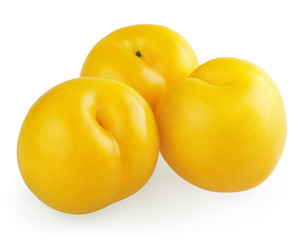 Three yellow plums isolated on white background
