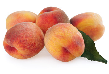 Ripe peaches with leaf isolated on white