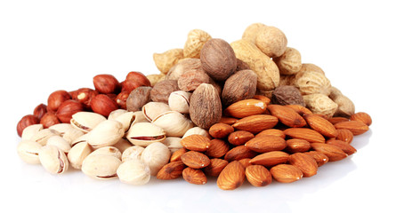 almonds, nutmeg, peanuts and pistachios isolated on white