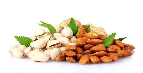 almonds, nutmeg, peanuts and pistachios isolated on white