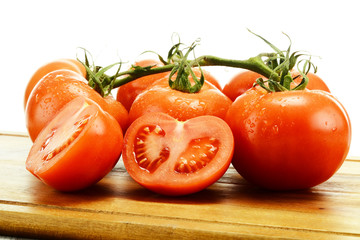 Tomatoes on breadboard isolated on white