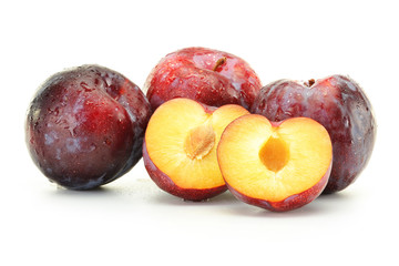 Composition with plums isolated on white background