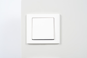 white light switch on the wall