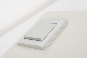 silver light switch on the wall