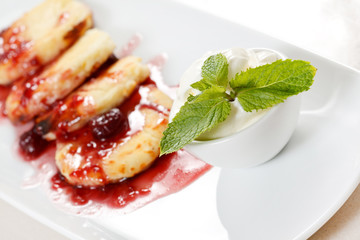 Cheese pancakes with cherry sauce