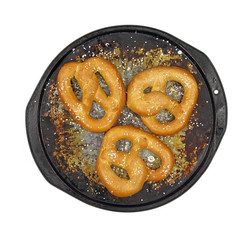 Soft pretzels salted on pan