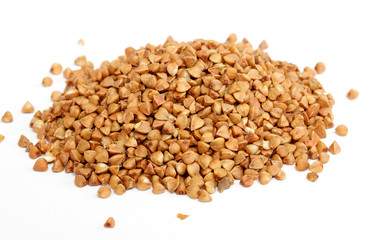 Isolated buckwheat on white background. Handful of grain