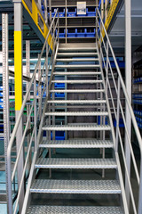 Grey metallic staircase on a stock bin