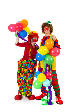 Couple funny clowns with balloons