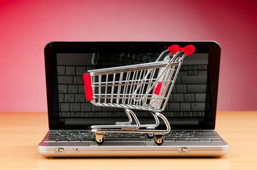 Internet online shopping concept with computer and cart