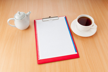 Binder with blank page and tea