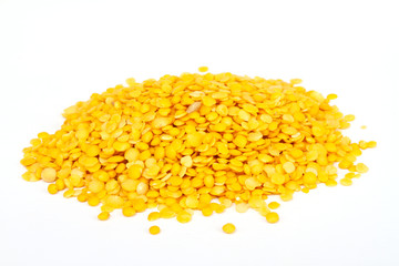 Yellow lentils isolated on white background.Macro shot.