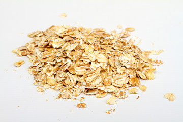 Oat flakes on white background