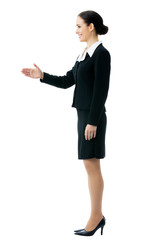 Full body portrait of smiling businesswoman giving hand