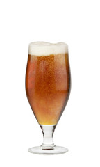 Alcohol dark beer glass with froth isolated over white.
