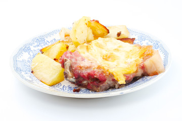 Grilled steak meat with cheese sauce and potatoes