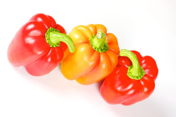 Orange and red pepper isolated on white